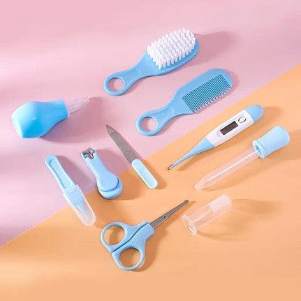 A blue baby care kit featuring thermometer, nasal inhaler, safety nail clippers, comb, and brush designed for grooming and caring for infant.