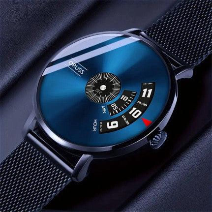 A sleek men's wristwatch featuring a metallic blue dial with a minimalist design. The watch has a unique time display with rotating dials for hours and minutes, and the brand name "ORUSS" is printed on the face. The watch is paired with a black mesh strap, adding a modern and sophisticated touch. It is presented in a gift box with a tag that reads "Quality of The Times."