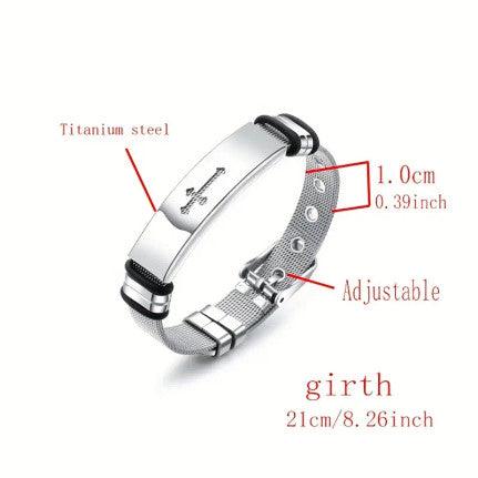 A sleek silver bracelet featuring a cross engraving on a polished metal plate. The bracelet has a mesh band with an adjustable buckle clasp, offering a modern and elegant design.