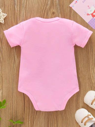 A playful short sleeve pink baby romper featuring the phrase "Give me the milk or nobody sleeps," perfect for a fun and humorous outfit.