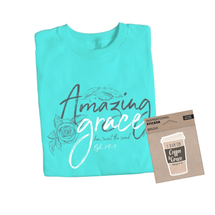 Folded teal T-shirt with "Amazing grace, how sweet the sound Eph. 2:8-9" printed in script.