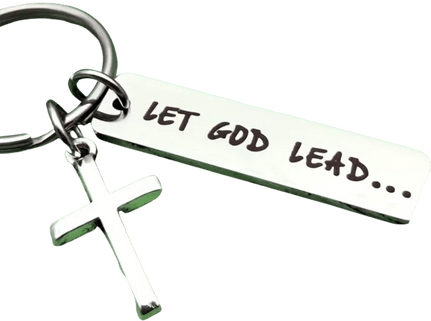 Silver keychain featuring a rectangular tag engraved with the phrase "Let God lead..." and a small cross charm attached to the keyring.