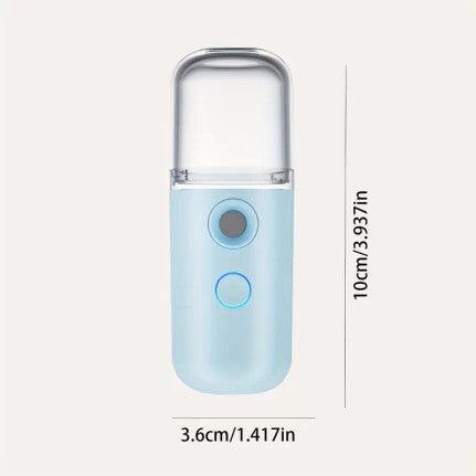 Compact blue portable mist sprayer with a clear top cover, shown with dimensions: 10 cm (3.937 inches) in height and 3.6 cm (1.417 inches) in width.