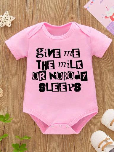 A playful short sleeve pink baby romper featuring the phrase "Give me the milk or nobody sleeps," perfect for a fun and humorous outfit.