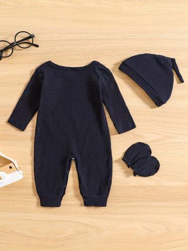 A cute baby Long Sleeve Baby Romper in Navy Blue accompanied by a matching hat and mittens, showcasing a cheerful and playful outfit displaying the text "Hi, I'm new here."