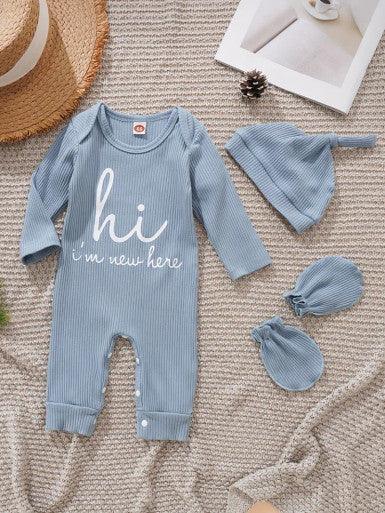 A cute baby Long Sleeve Baby Romper in Sky Blue accompanied by a matching hat and mittens, showcasing a cheerful and playful outfit displaying the text "Hi, I'm new here."