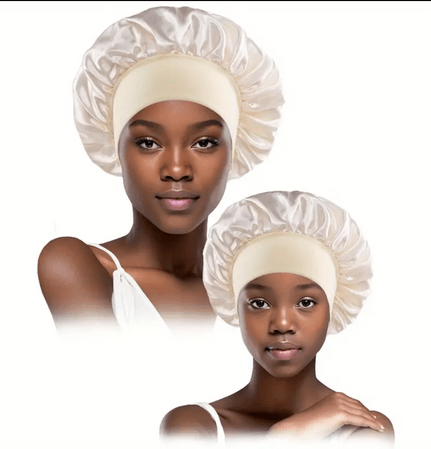  Two models wearing matching white satin bonnets, one adult and one child. The bonnets are designed to protect hair while sleeping, featuring a smooth, shiny finish and a wide elastic band for a secure and comfortable fit. The satin material helps reduce friction, preventing hair breakage and maintaining moisture.