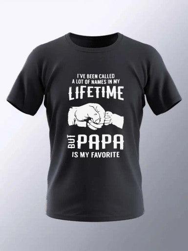 A black T-shirt featuring the text "I've been called a lot of names in my lifetime, but Papa is my favorite" printed in bold white letters on the front. The design includes an illustration of two fists bumping together, symbolizing a strong bond, likely between a grandfather and his grandchild. The shirt is casual and sentimental, perfect for a proud grandfather.