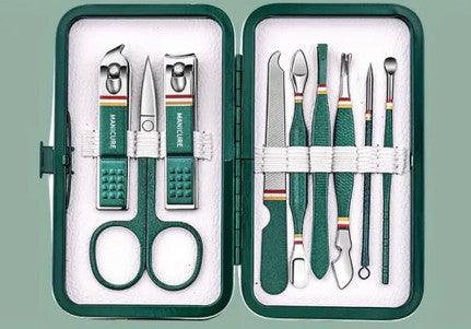 A green manicure set neatly arranged in a matching green case. The set includes various stainless steel tools such as nail clippers, scissors, tweezers, a nail file, and cuticle pushers, all secured with white elastic bands. Each tool features a green handle with a textured design, offering both practicality and a cohesive, stylish look, ideal for personal grooming or travel.