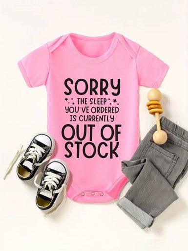  A humorous short sleeve baby pink romper displaying the text "Sorry the Sleep You've Ordered is Currently Out of Stock," ideal for a fun and humorous outfit.