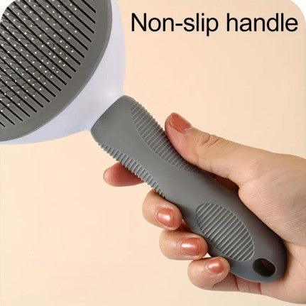 The image shows a pet grooming brush against a light blue background. The brush features a wide, rectangular head with closely spaced metal bristles designed for removing loose fur and detangling. The ergonomic handle is gray with a textured grip for comfortable use. The brush's dimensions are indicated, with a width of 11 cm (4.33 inches) and a length of 21 cm (8.26 inches). The brush is positioned upright, leaning against a white step-like object.