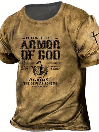 Brown distressed-style T-shirt with the text "Put on the full armor of God, so that you can take your stand against the devil's scheme. Ephesians 6:11" printed in bold, with a cross graphic on the sleeve.